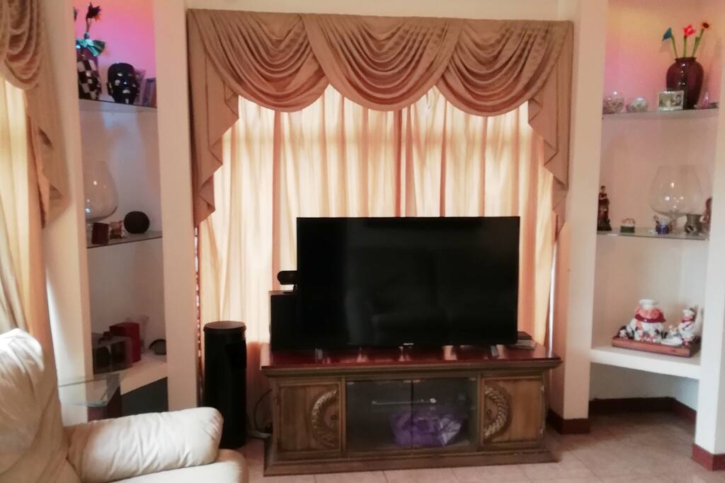 Living room reclinable sofa chairs and with 52" cable TV.