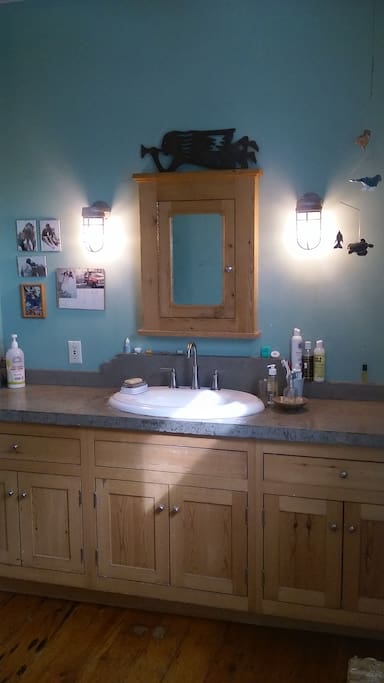 Full bath on second floor includes hand made (by Paul) cabinetry and poured concrete counter tops.