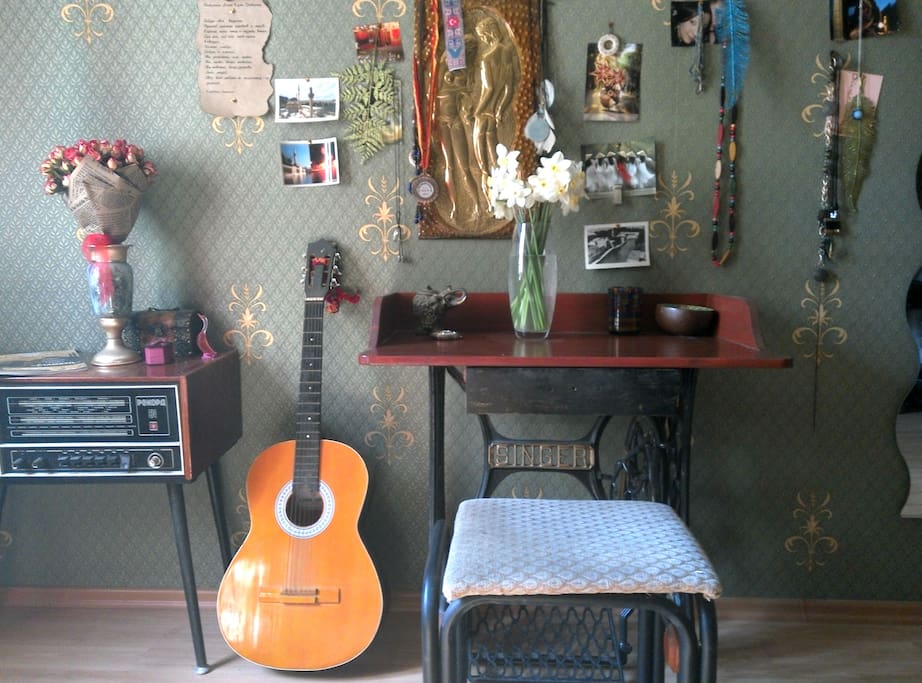 Room #1 Wonderland. An old radio and vintage desk made of an old sewing machine.