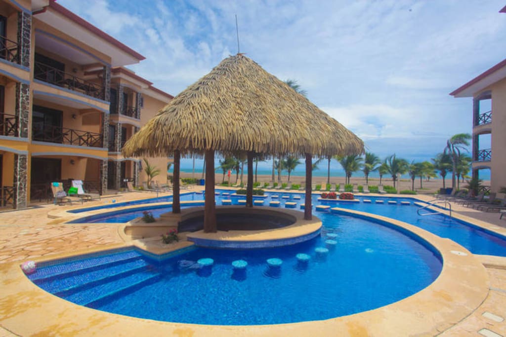 Resort style pool that is beachfront right in front of the boardwalk
