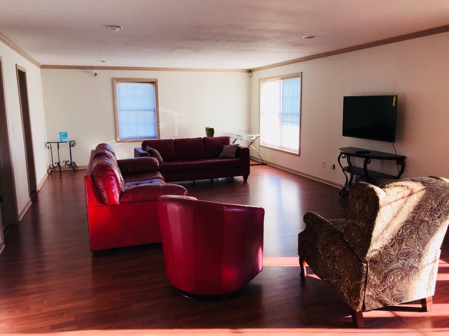 Different view of living room floor showing windows