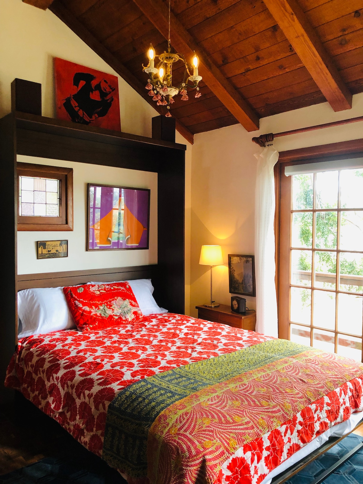 Queen Murphy wall bed - it folds up and out of the way when you don't need it. Super comfortable!