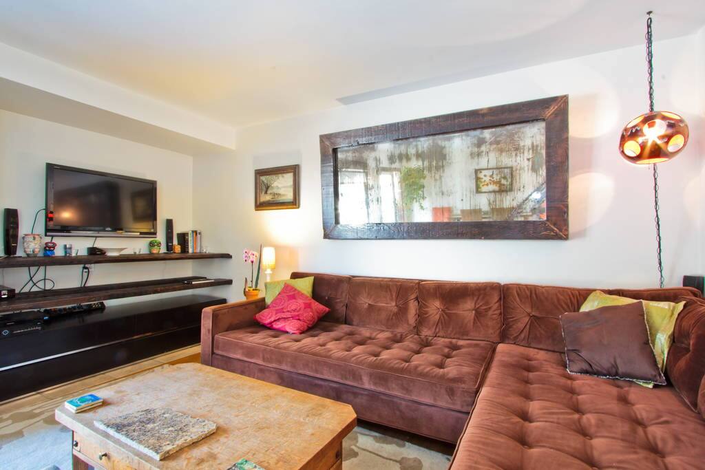 Deep seated l-shaped couch can comfortably sleep 2