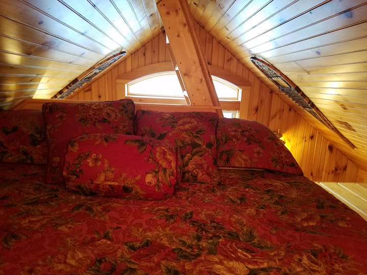 King Size Bed in loft with picture window views of Lake Eden