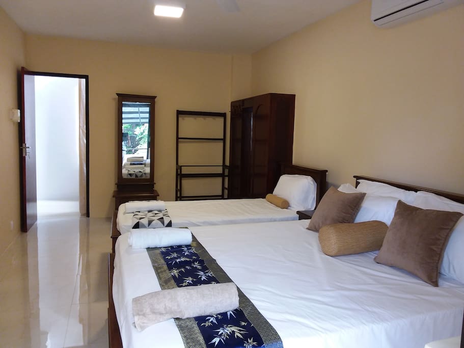 Spacious Bedroom 1 with a Queen and a Single size beds