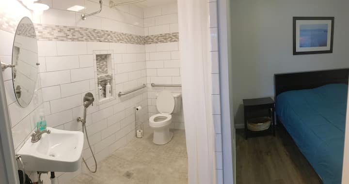 The ensuite master bathroom.  Beautifully tiled to to the ceiling and fully wheelchair accessible.