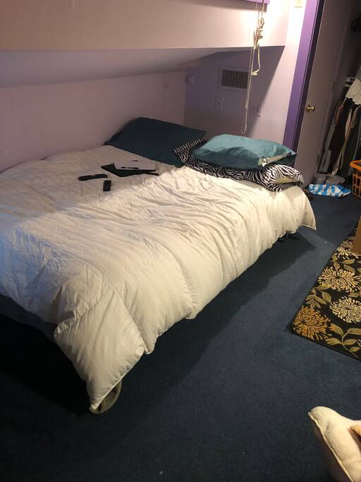Queen bed in upstairs loft of bedroom