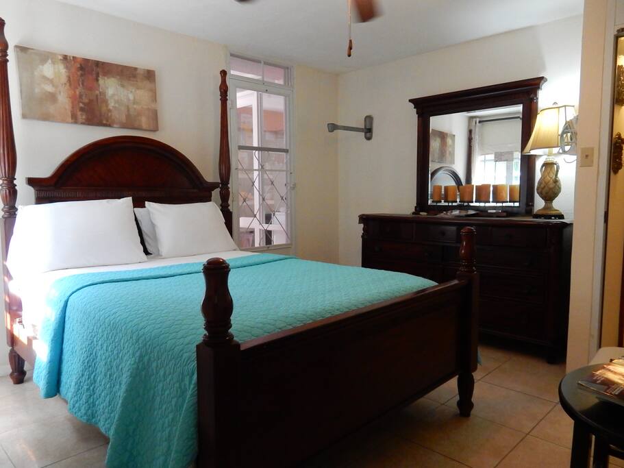 A view of the Queen bed and dresser.