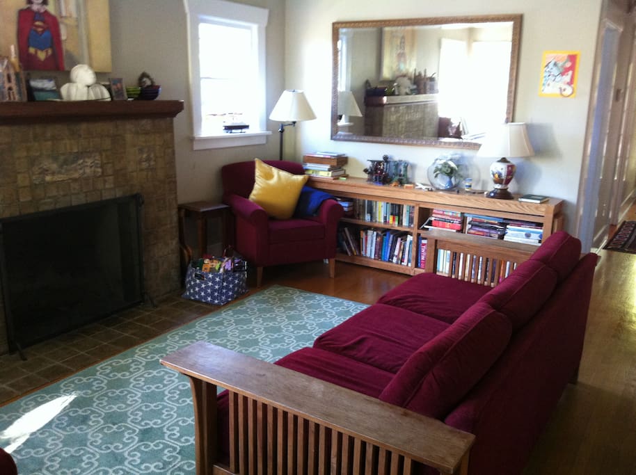 The living room is a comfortable place to enjoy a book or conversation.
