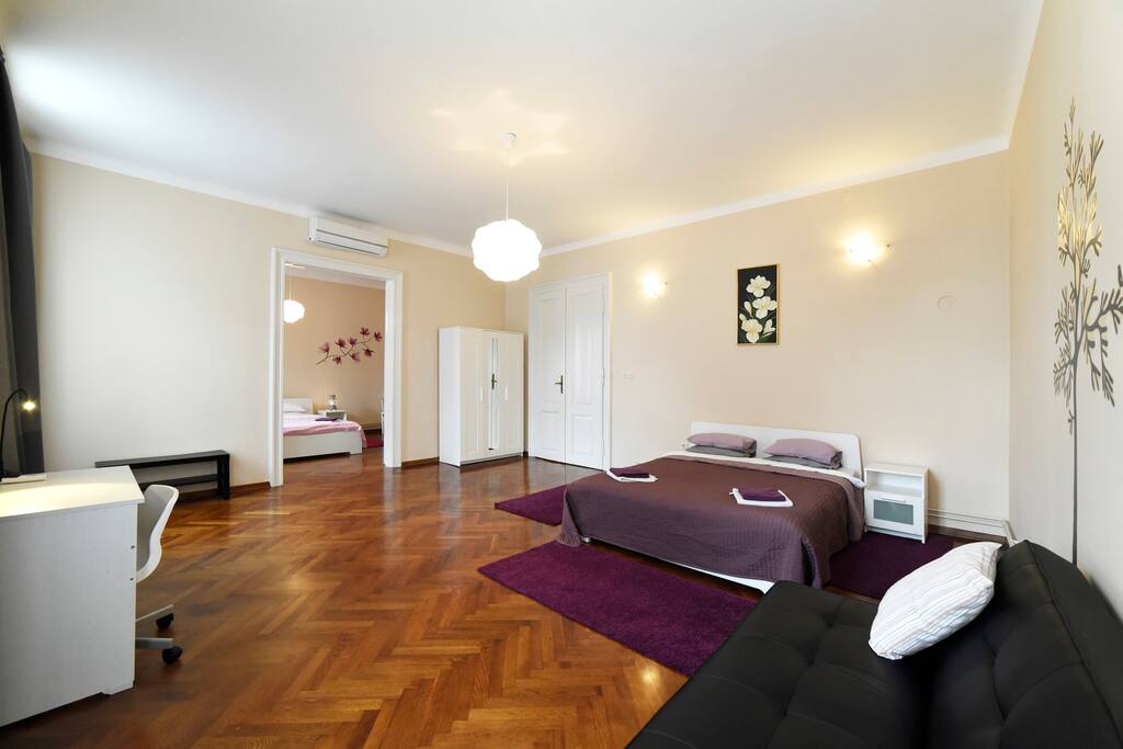 Double bed. Couch. Wardrobe. Desk and chair.