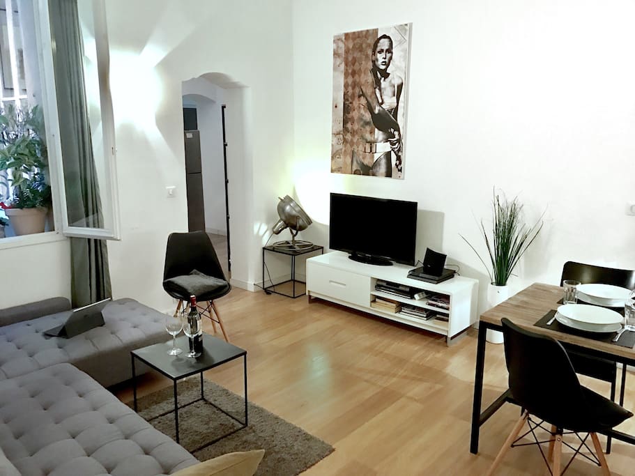 The living room with a large corner sofa and dinner table for 6 guests