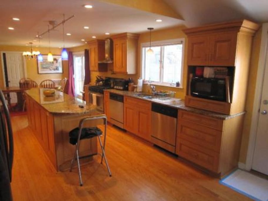 Large kitchen with marble counter tops, hardwood floors, 6 burner stove