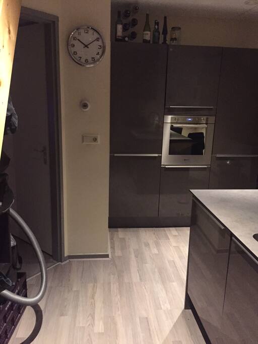 Kitchen including microwave, oven and coffee machine. Also a fridge and a freezer.