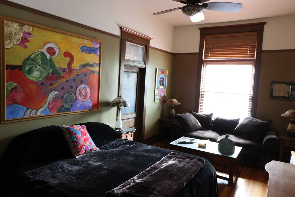 The room has a suite-style to it and is adorned by original artwork by Jesus Tells