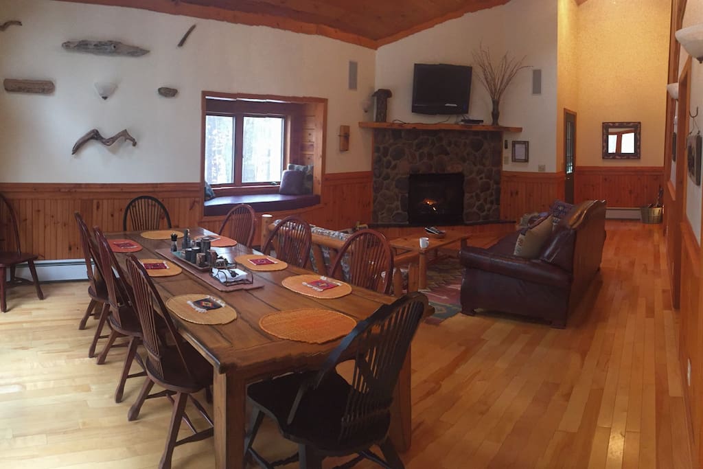 Dining and living room with window seat. TV has Hulu/Amazon streaming DVD player.
