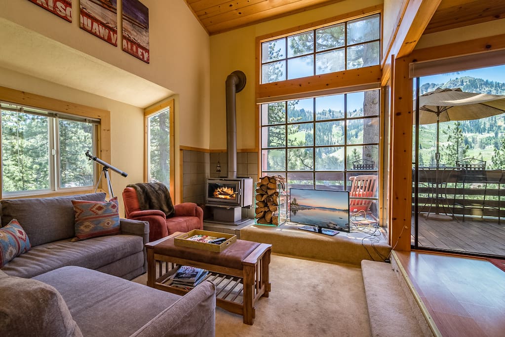 Large windows fill the living room with natural light.