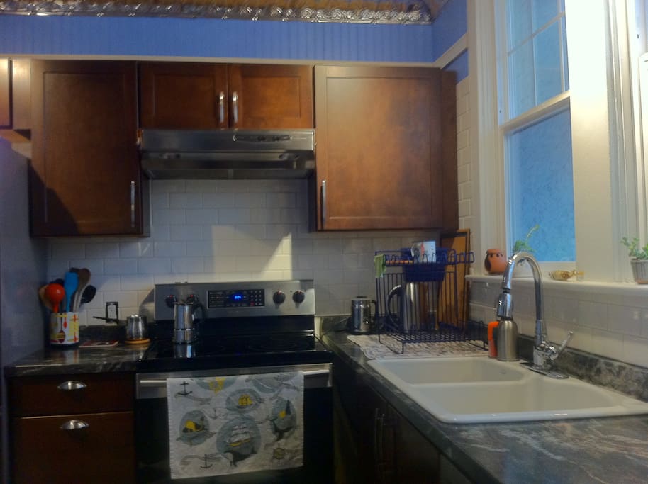 Newly renovated kitchen with new range and dishwasher