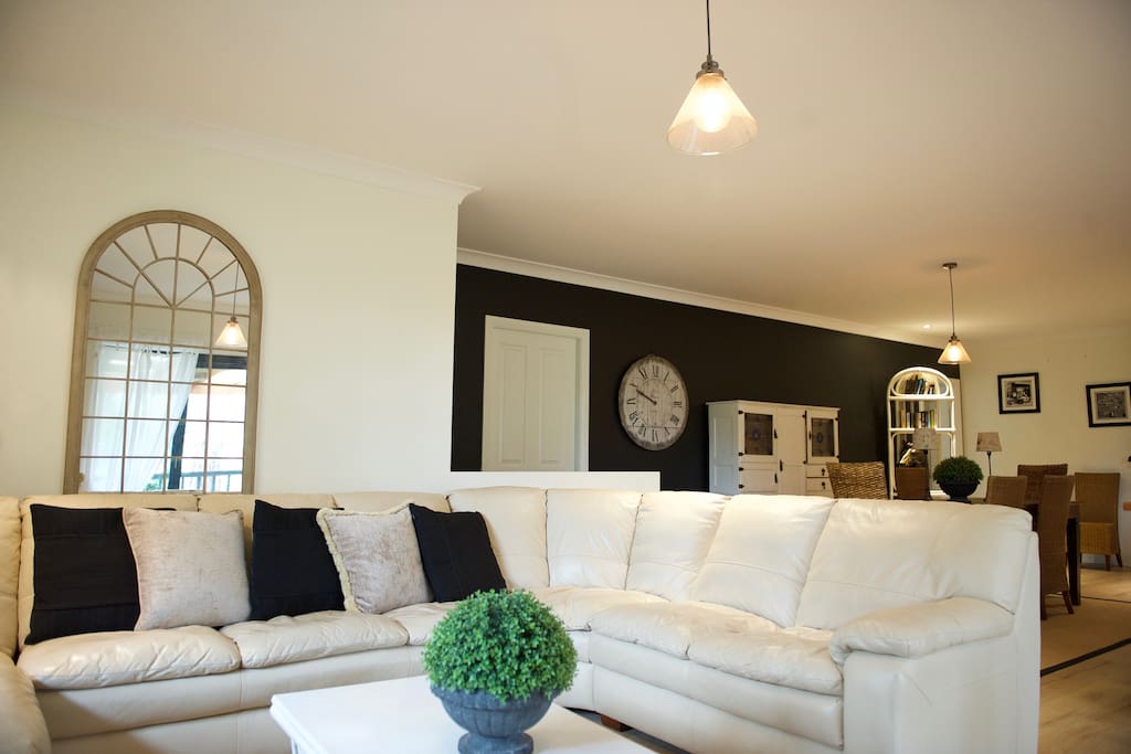 Plenty of comfortable seating to relax on around the fire.