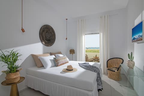 Stroll barefoot to the beach from a boho tiny home