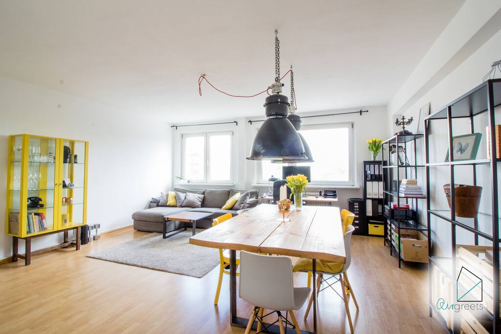The living room is furnished in a modern way with stylish pieces furniture.