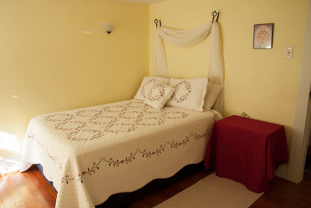 full size bed with big bathroom across the hall. room has a closet and dresser