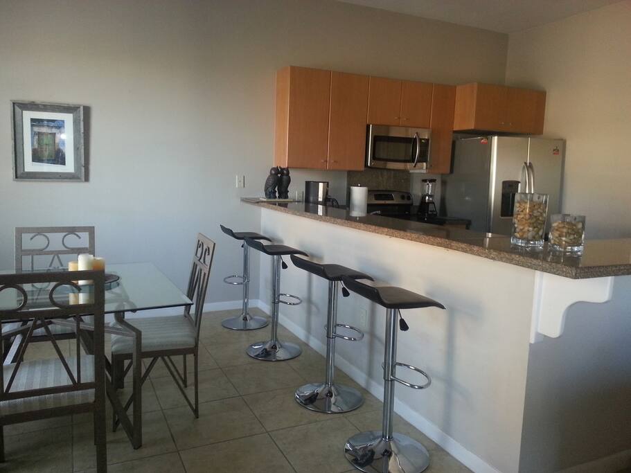 Dining room and open kitchen. I work on laptop at the granite countertop. Lots of convenient
electrical outlets.