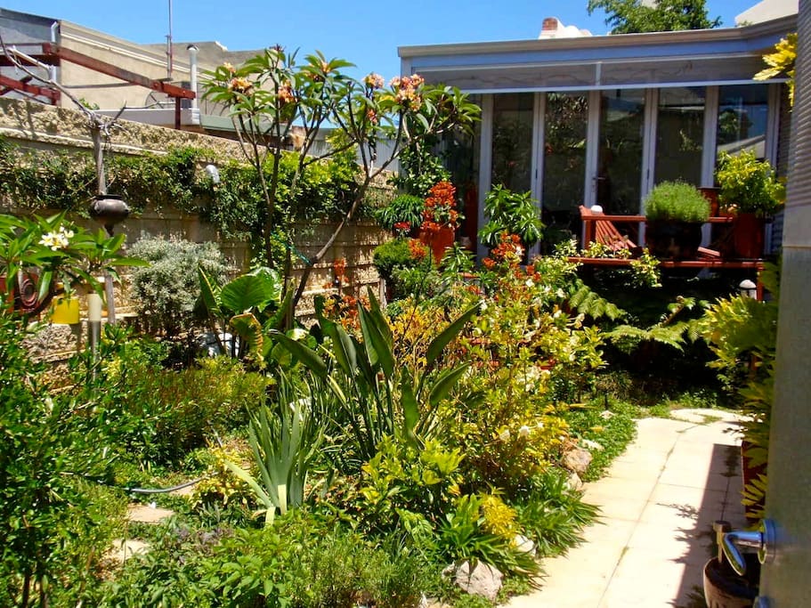 Entry to the apartment through the private, secluded garden.