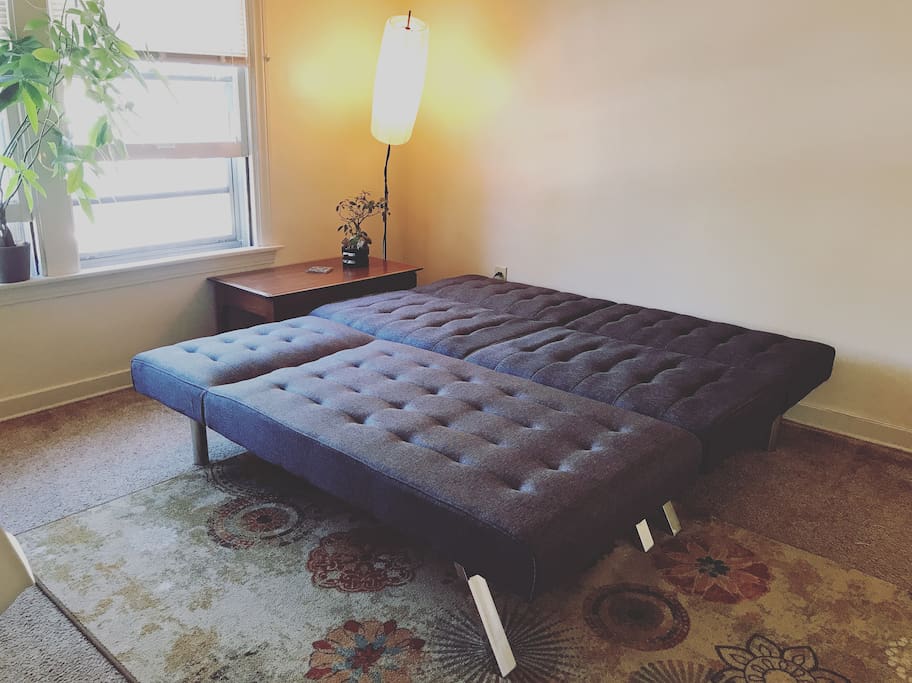 futon and chaise forms a comfy queen size bed