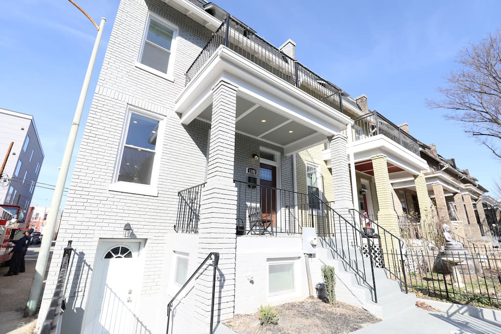 Our home is a spacious & unique corner row home with tons of natural light, a backyard, a private parking space, and 4 balconies!