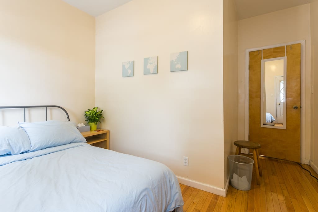 The room - includes double bed, a/c, clothing rack, night stand, and exclusive access to back yard