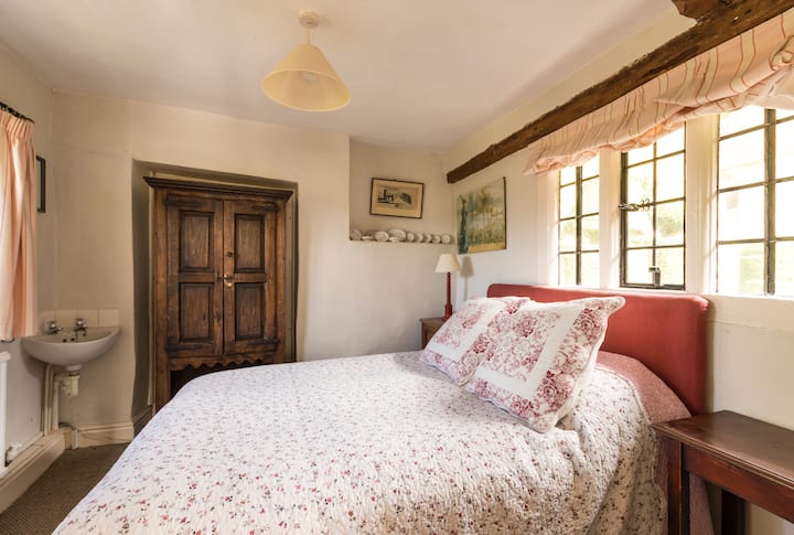 Master bedroom looking west across the valley and east into Owlpen's ancient gardens