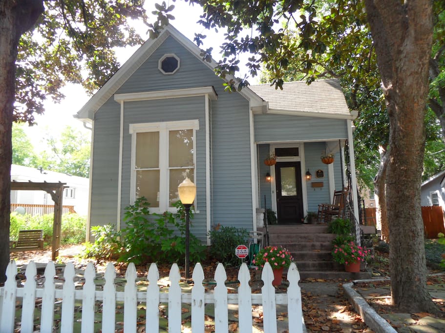 Adorable historic home with white picket fence and front porch