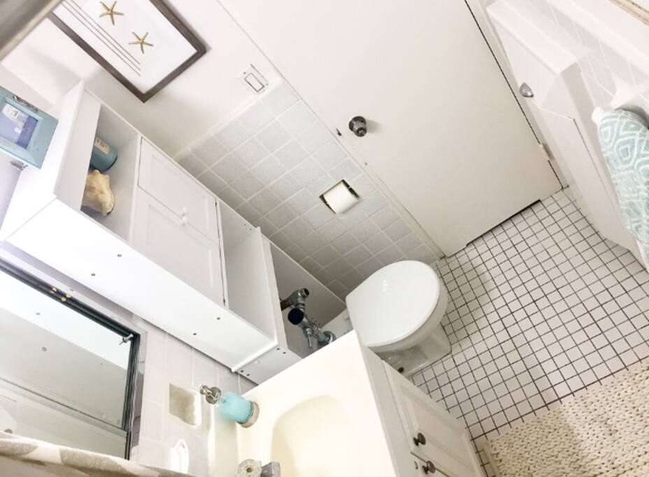 Shared bathroom with a serene and tranquil decor.