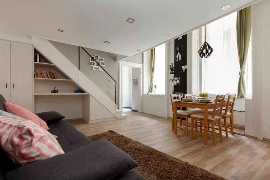 Living room area with the dining table and our favourite piece of wall-art by Levi's sister:)