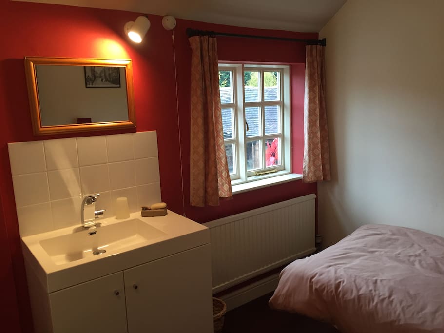 Twin bedroom with basin
