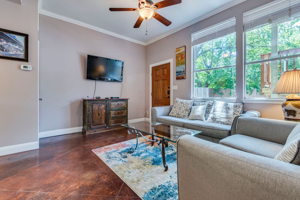 Relax in the elegant living room with lots of natural light and 46 inch flat screen TV