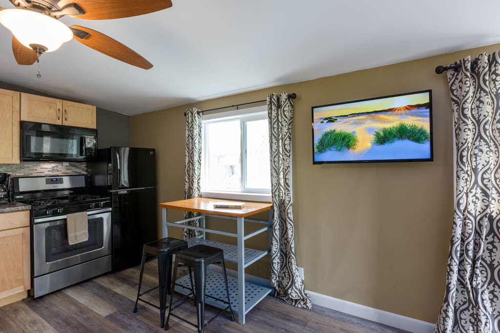 A smart tv and dining table