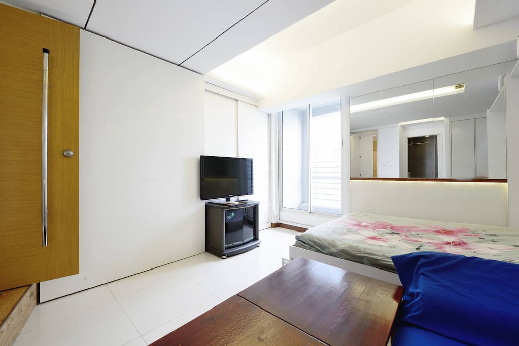 42" LED TV. Door leads you to Pte lobby and kitchen