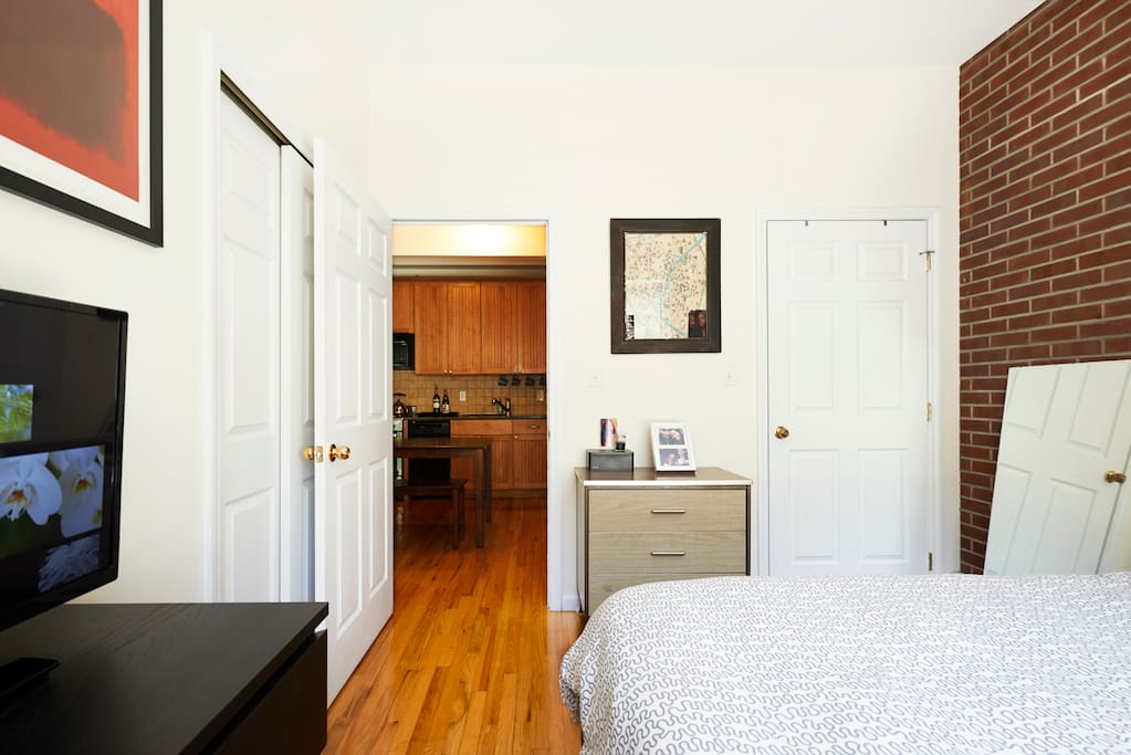 Bedroom with closet and TV, opens to Kitchen/Dining