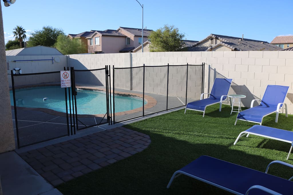 Swimming pool with gate and lounge