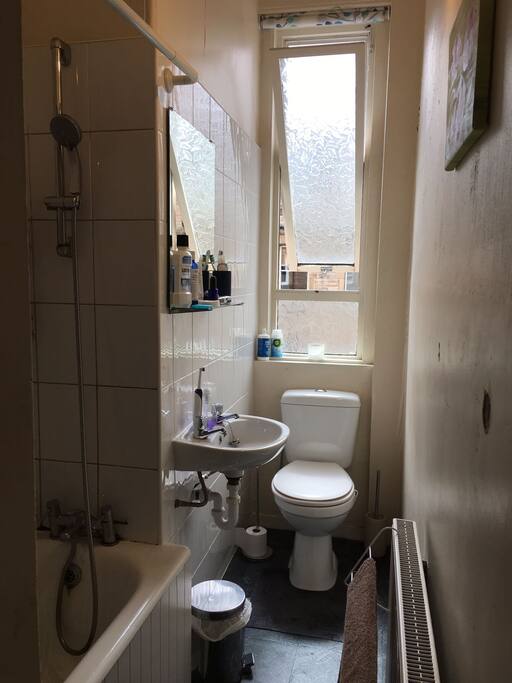 Bathroom including shower and bath tub
