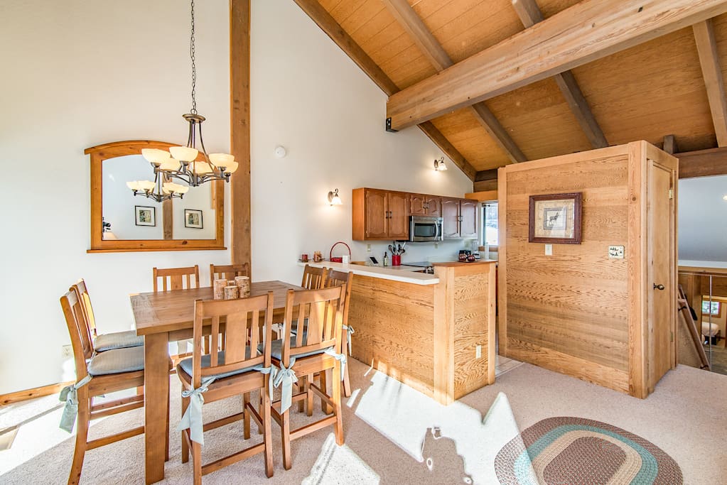 The airy and bright living room is open to the kitchen and dining area.