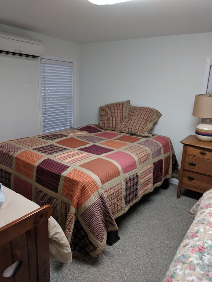 Front Bedroom includes 1 queen bed and 2 twin beds