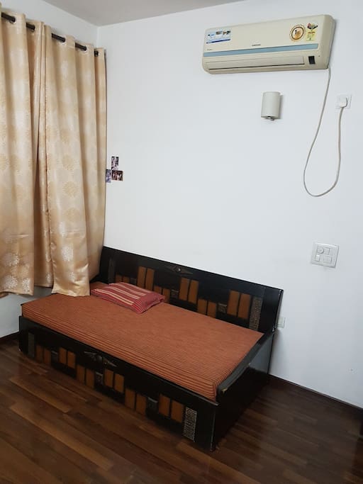 another view of room. Bed is extendable. Air conditioner is installed.