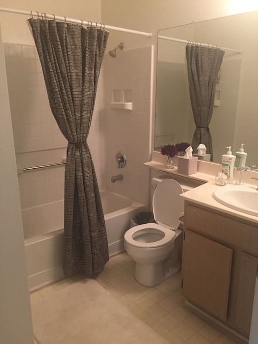 Bathroom has a full sized tub, and toiletries for your convenience.