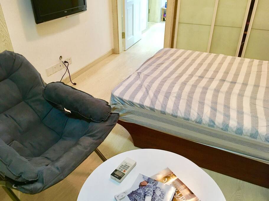 A small place to relax next to the bed