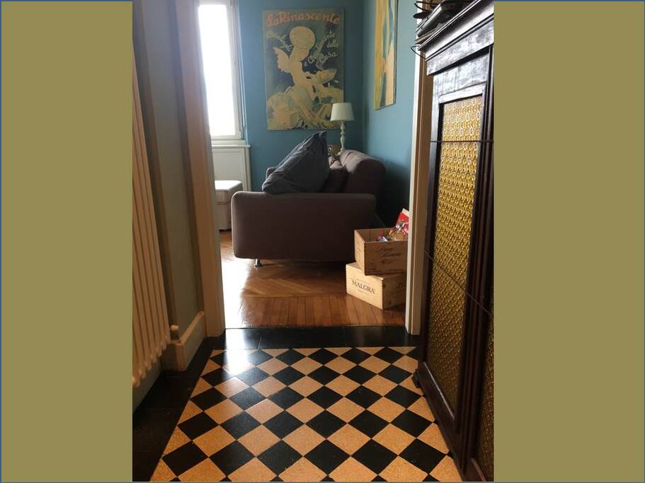 black and white tiles pavement leading to the living room