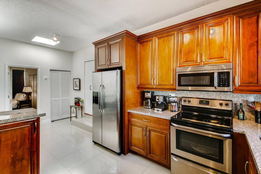 Programmable coffee pot & espresso machine to help you wake up in the morning as well as a big beautiful kitchen with every appliance you could possibly need.