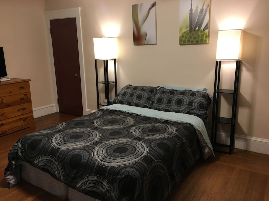 The bedroom is comfortable and calming with light blocking curtains and an essential oil diffuser for a good night's sleep.