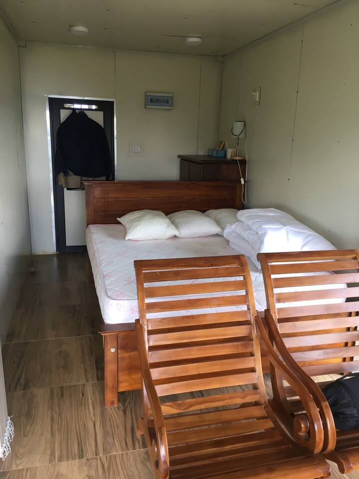 Private double room with lake views. 
And a private bathroom on the upper level of the cabin. 